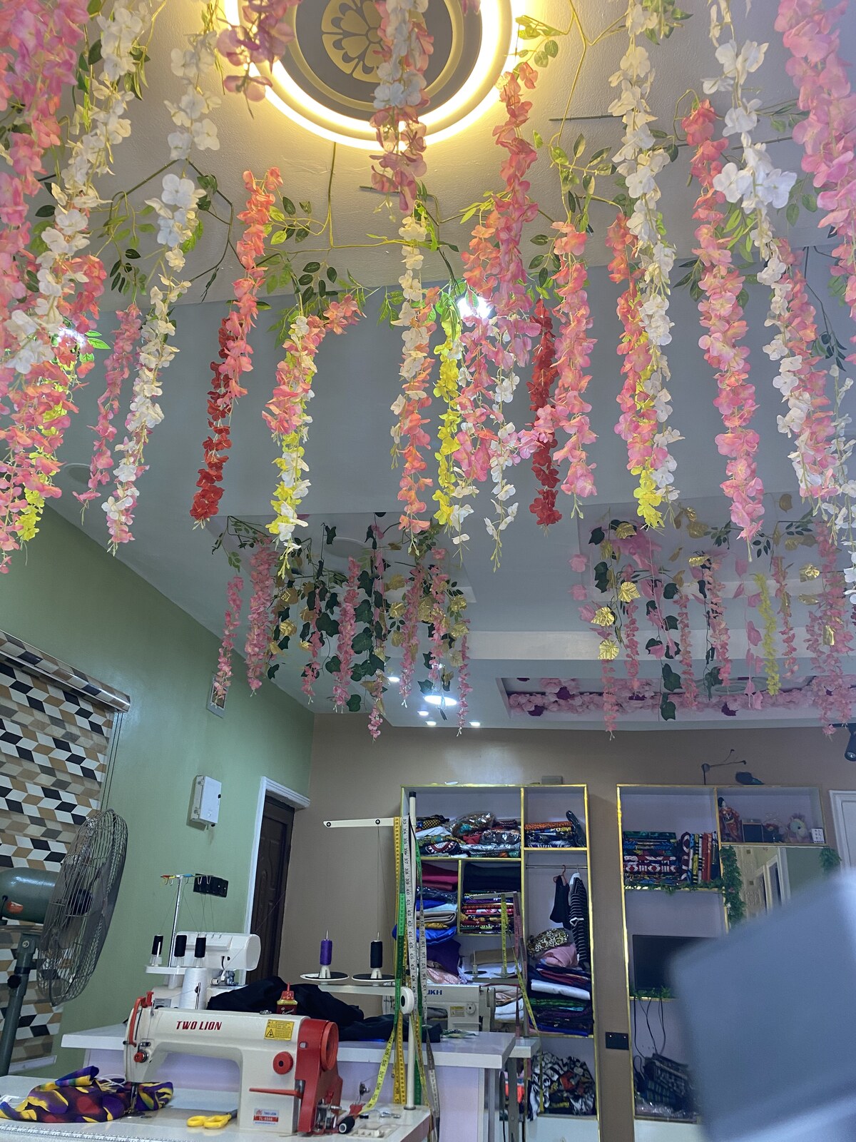 Atelier workshop under the signature floral ceiling