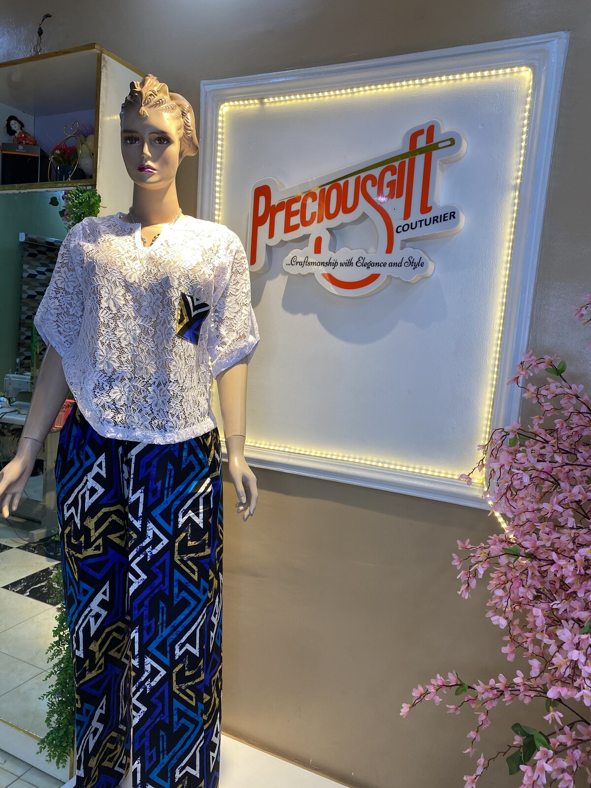 White lace blouse and printed maxi by the brand wall
