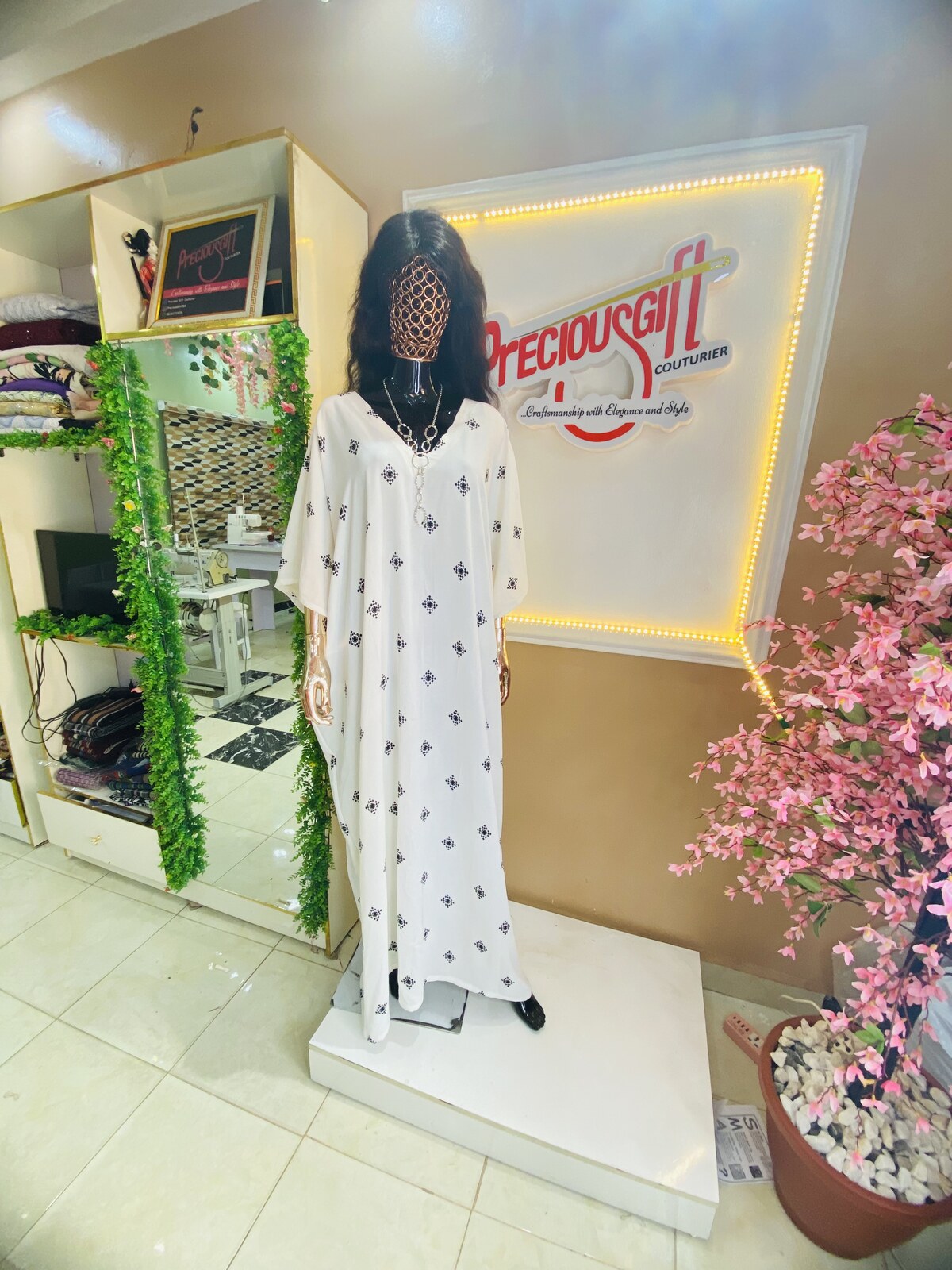 Embellished white kaftan on display